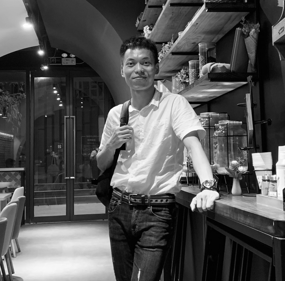 Forty year old male executive in dark suit and tie, professional headshot with confident expression and corporate background